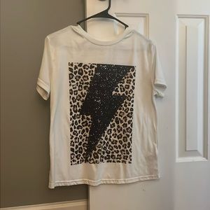 White shirt with a cheetah background and a black vintage lightning bolt!